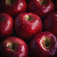 Fresh red apples with water droplets create vibrant and appetizing display photo