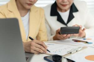 Business team calculate benefit working woman, spreadsheets, graph financial development, bank accounts, statistics, economy, data analysis, investment analysis, stock exchange, rates income photo