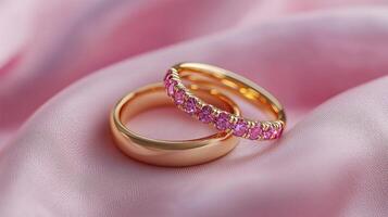 A pair of gold wedding rings on pink fabric, a romantic and dreamy background. 16 photo