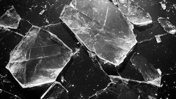 Broken glass surface isolated on black background.13 photo
