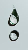 Different sizes and shapes of transparent droplets, symbolizing the diversity in beauty products. 3 photo