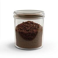 Glass container of coffee grounds, on a white background. photo