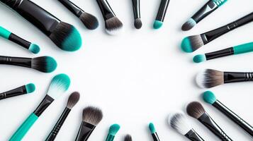 Cosmetic brushes frame, placed in random order, on a white background. 11 photo