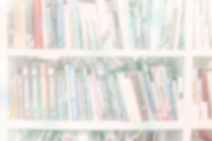 Blur bookshelf with books. Background with light colors. photo