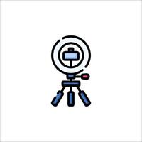 A camera on a tripod with a light on it vector