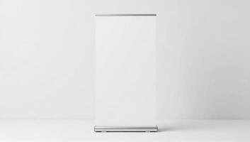 A white roll up banner stand on a white surface photo