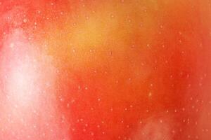 Macro photo of red apple texture with yellow color as background.