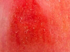 Texture of a red apple as a background macro photo