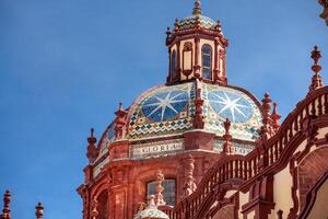 Close up of the dome of the beautiful historic Church of Santa Prisca built between 1751 and 1759 located on the east side of the main plaza of Taxco de Alarcon. photo