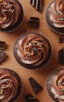 chocolate cupcakes is adorned with rich, swirled chocolate frosting and colorful sprinkles photo