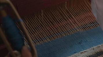 weaver makes fabric in ethnic loom 2 video