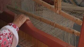weaver makes fabric in ethnic loom 20 video