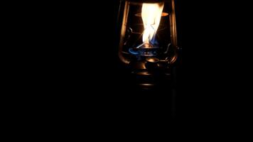man walking in a dark corridor with a oil lamp video