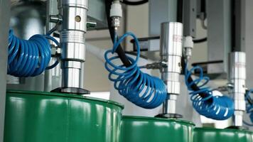 Motor oil in barrels with pump indoors with copy space. Store of lube. Product for bottling close up. Maintenance. Warehouse inside. Background of automotive shop. Auto service. Change of oil. 3 video