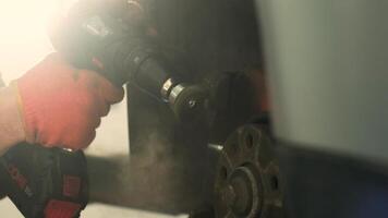 Mechanic is using a brush to clean dust from the drum brake. Selective focus. 2 video