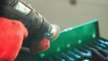 Mechanic is using a brush to clean dust from the sleeve. Selective focus. video