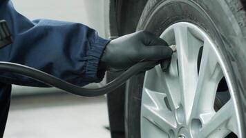 Cheking air pressure in automobile car wheel after tyre fitting or tire replacing for winter type video