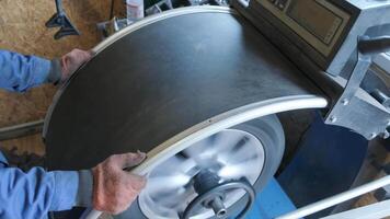 Mechanic worker makes computer wheel balancing on special equipment machine tool in auto repair service, toned photo with motion effect 4 video