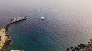 Aerial 4K View Of Sailing Catamaran In Rocky Bay video
