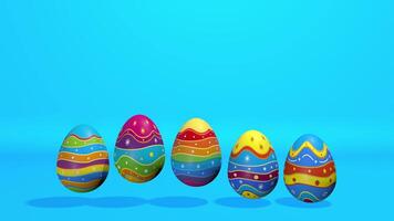 Five Easter eggs decorated with stripes of yellow, orange, red, blue, green and purple bouncing on a blue surface with a light blue background. Loop sequence. 3D Animation video
