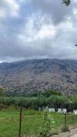 View of the mountain that is on the island, cloudy day in summer, clouds in the sky video