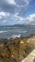 Beautiful view of the seashore, sea waves approaching the shore, cobblestones lying on the shore video