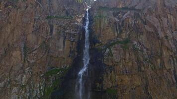 small waterfall in mountain valley in Tian Shan Mountains, Aerial Drone point of view video