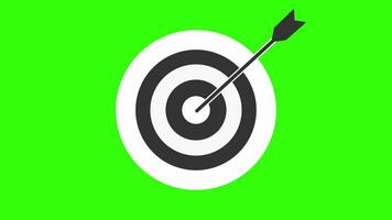 An arrow strikes the center of the target, the precision and focus required to hit the bull's eye, accuracy, strategy, bullseye, and goal-oriented performance. The dartboard on a green screen video