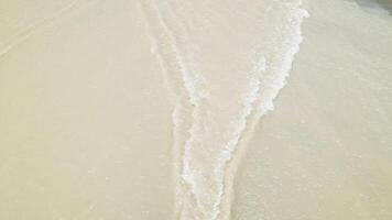 murky water flowing in concrete spillway flat bottom, view from above. video