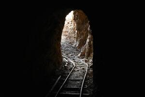 Abandoned Underground Mine Exit with Rail for Ore Carts in Arizona photo