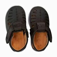 Children black shoes isolated on white background photo