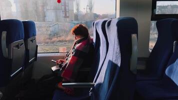 Train Journey with Passenger Enjoying Some Leisure Time Using Their Smartphone video