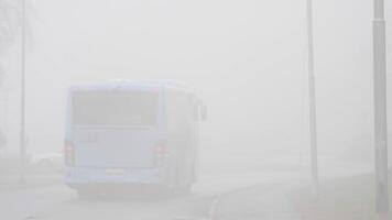 Bus driving into the Mist and Disappearing, Low Visibility, Travel into Unknown video