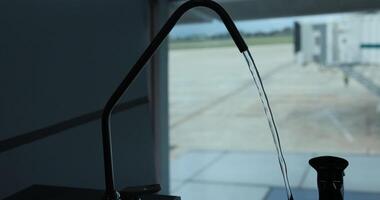 Water sprouting from the tap of a round drinking fountain video