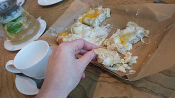 Enjoying a delicious pizza and cheese served on a rustic wooden table video