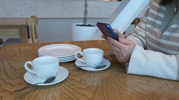 Enjoying Coffee Break While Using a Smartphone for Relaxation and Communication video