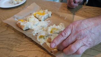 Delicious Pizza Topped with Fresh Eggs and Melted Cheese on Rustic Wooden Table video