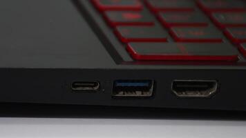 Hand connecting a USB cable to a PC, plugging device into computer USB port video