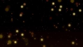 Beautiful Gold Floating Dust Particles with lens flare light special effect and bokeh on black background. 4k Ultra HD video