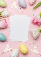 Easter card mockup with colorful eggs and tulips on pink background photo