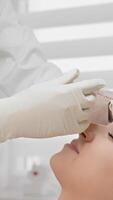 In a clinical setting, a skilled professional administers botulinum injections to the patients forehead, targeting and reducing wrinkles, demonstrating an effective cosmetic procedure video