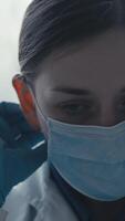 A dedicated medical scientist in lab attire, including a mask and goggles, is carefully preparing for crucial vaccine research in a stateoftheart laboratory designed for immunization studies video