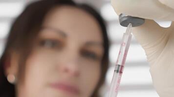 The image depicts a skilled healthcare professional meticulously preparing a botulinum injection, which is a widely used cosmetic procedure that effectively targets and eliminates facial wrinkles video