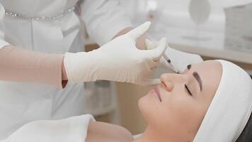 A skilled cosmetic specialist administers precise botulinum injections to reduce facial wrinkles, allowing the client to relax as the treatment targets those persistent fine lines video