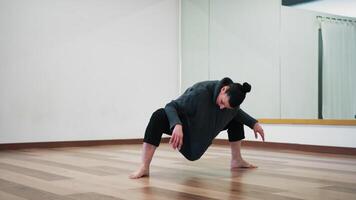 In the Ballroom A Lonely Woman Practices Postural Dance For The Back video