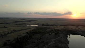 Windmills for electric power production in a windmill park at sunset showcasing sustainable energy solutions video