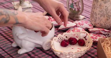 Engage in the colorful activity of painting Easter eggs as detailed steps are shared. video