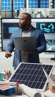 Vertical Photovoltaics plant researchers evaluating solar cells to identify weaknesses and improve energy production. Solar panels factory experts optimizing tech for better energy absorption, camera A video