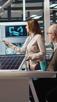 Vertical Photovoltaics plant researchers conduct performance analysis on solar cells to identify material weaknesses and improve overall energy output, optimizing designs for better energy absorption, camera A video