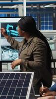 Vertical Factory research and development division scientists collaborate to test nanomaterials for next generation solar panels, aiming for breakthroughs in durability and performance, camera A video